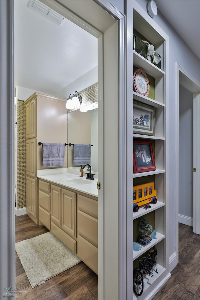 bathroom with vanity and hardwood / wood-style floors