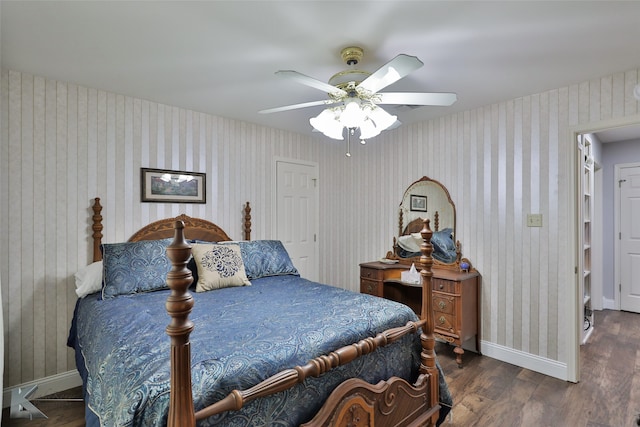 bedroom featuring ceiling fan and dark hardwood / wood-style floors