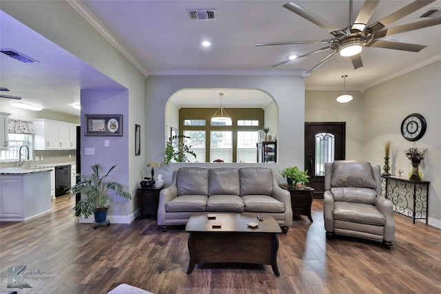 living room with crown molding, sink, ceiling fan, and dark hardwood / wood-style floors