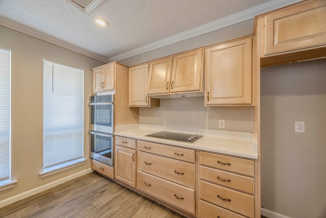 kitchen featuring light brown cabinets, double oven, light wood-type flooring, black electric cooktop, and ornamental molding