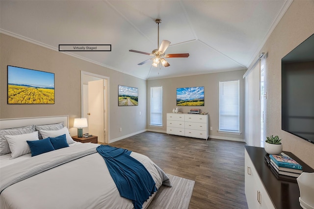 bedroom with crown molding, ceiling fan, dark wood-type flooring, and vaulted ceiling