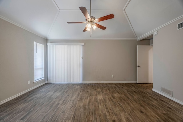 empty room featuring ornamental molding, dark hardwood / wood-style floors, and lofted ceiling