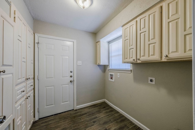 clothes washing area featuring cabinets, electric dryer hookup, dark hardwood / wood-style flooring, hookup for a washing machine, and a textured ceiling