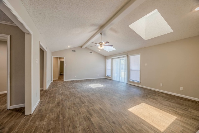 unfurnished room featuring a textured ceiling, ceiling fan, lofted ceiling with skylight, and hardwood / wood-style flooring