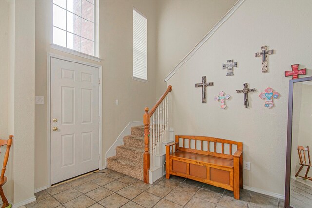 foyer entrance featuring light tile patterned flooring