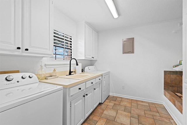 6005 Englishoak Dr, Arlington, TX 76016 - laundry room featuring cabinet space, washer and dryer, light stone finish flooring, and electric panel