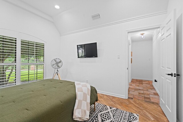 bathroom with crown molding, vanity, and a bathing tub