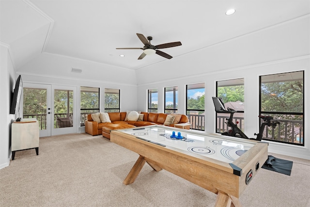 playroom with light carpet, french doors, ornamental molding, lofted ceiling, and ceiling fan