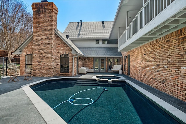 6005 Englishoak Dr, Arlington, TX 76016 - view of pool with french doors, a pool with connected hot tub, and a patio