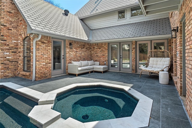 6005 Englishoak Dr, Arlington, TX 76016 - view of swimming pool with french doors, a patio, an in-ground hot tub, and an outdoor living space
