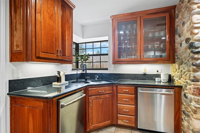 6005 Englishoak Dr, Arlington, TX 76016 - kitchen with stainless steel dishwasher, glass insert cabinets, dark stone countertops, and brown cabinets
