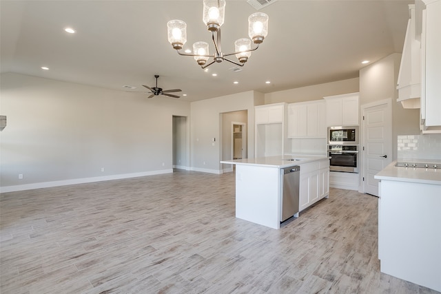 kitchen featuring light hardwood / wood-style flooring, white cabinetry, a center island, and stainless steel appliances