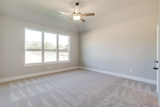 empty room with ceiling fan and carpet flooring