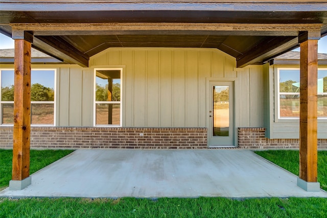 property entrance featuring a patio