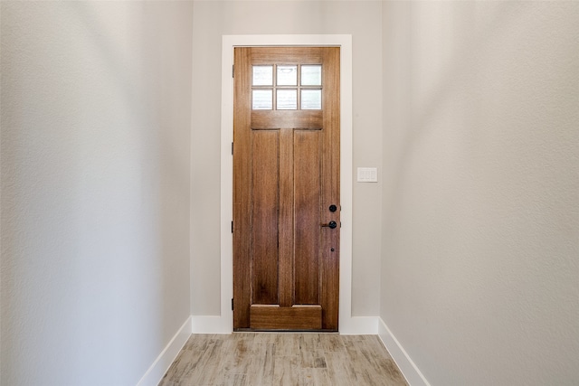 doorway to outside featuring light wood-type flooring