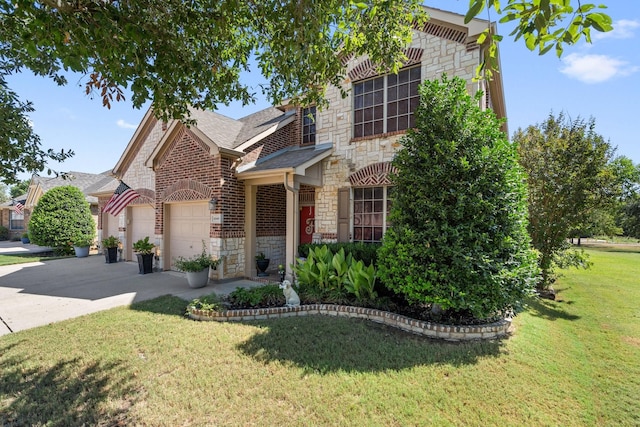 view of front of home featuring a garage and a front lawn