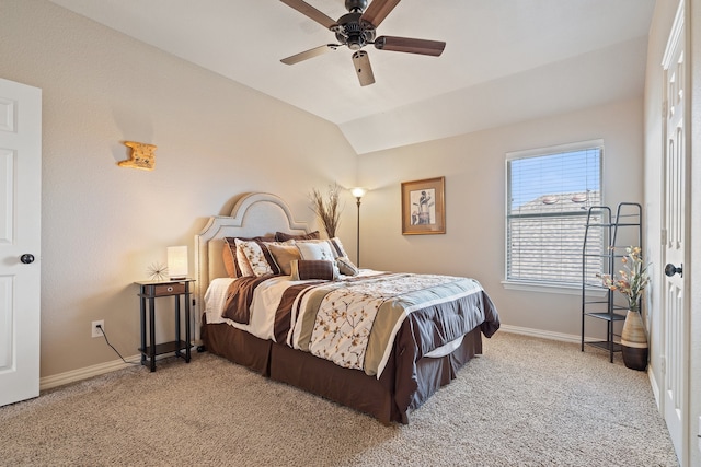 bedroom with light colored carpet, vaulted ceiling, and ceiling fan