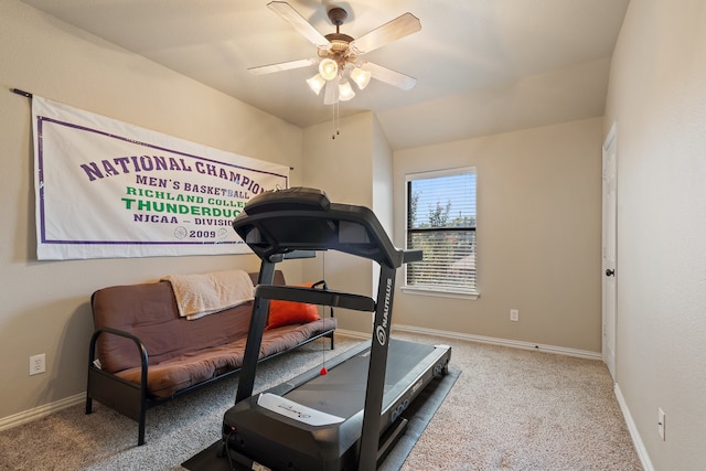 workout area with ceiling fan, carpet, and lofted ceiling