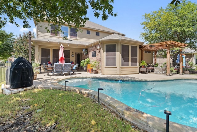 view of pool featuring a pergola, grilling area, and a patio