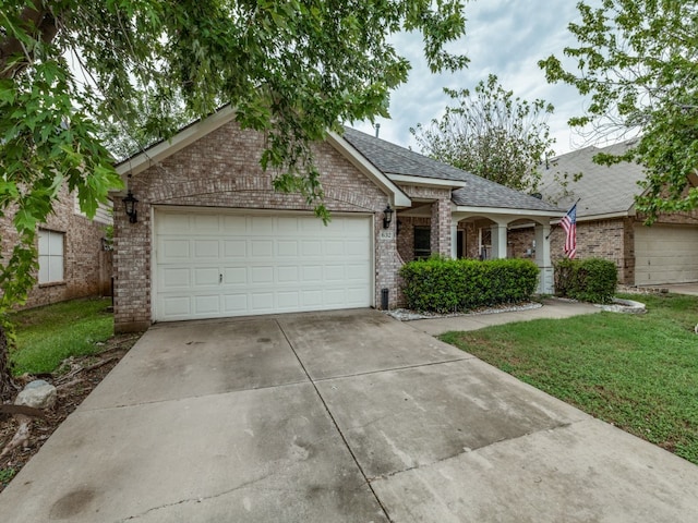 ranch-style house with a garage and a front yard