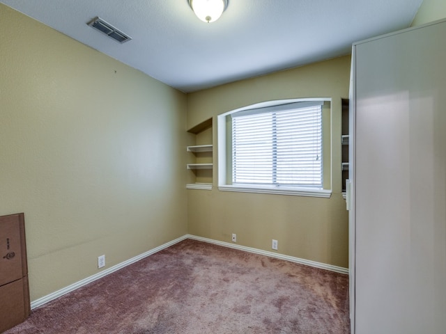 empty room featuring carpet