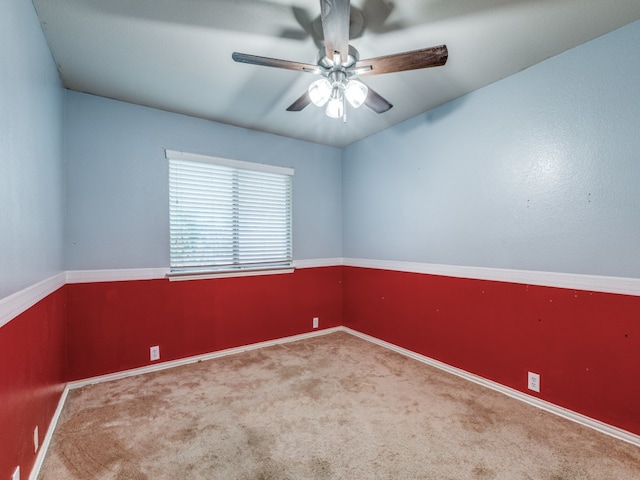 spare room with carpet and ceiling fan