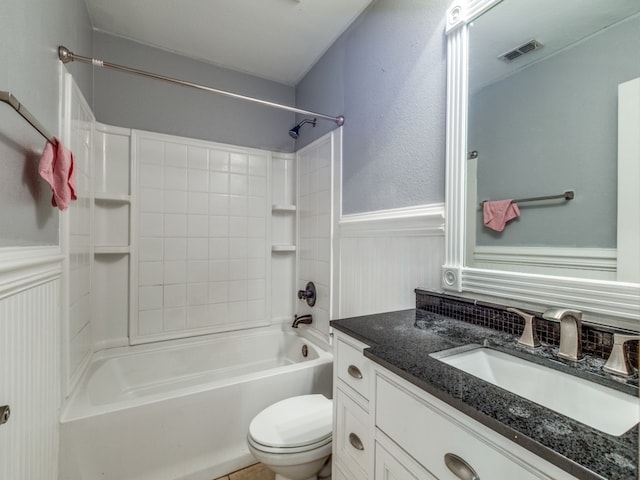 full bathroom featuring vanity, toilet, and  shower combination