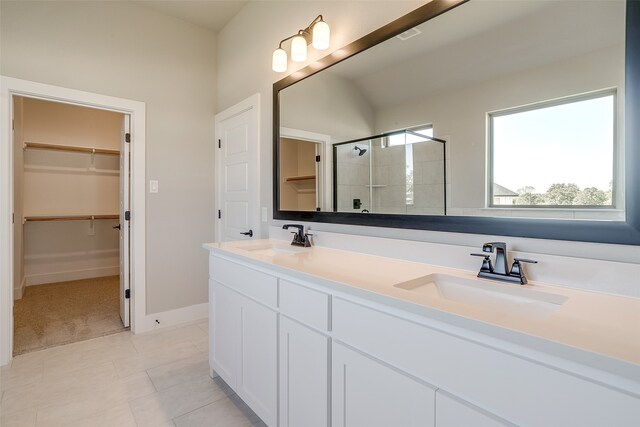 bathroom featuring vanity, tile patterned floors, and an enclosed shower