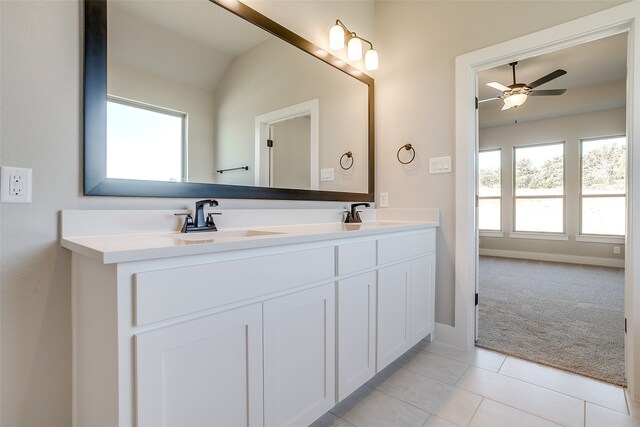 bathroom with vanity, ceiling fan, tile patterned floors, and lofted ceiling