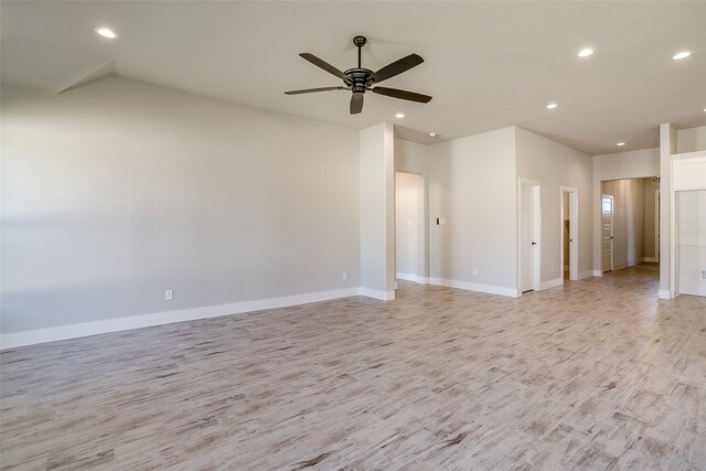 unfurnished living room with ceiling fan and light hardwood / wood-style flooring