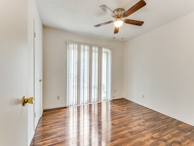 spare room featuring hardwood / wood-style floors and ceiling fan