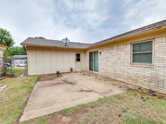 rear view of property featuring a patio area