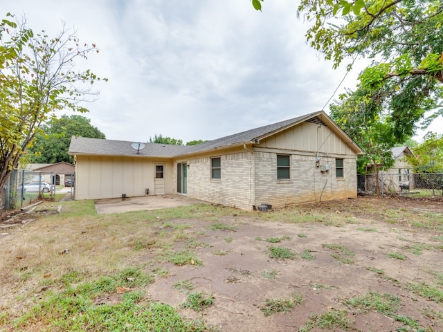 back of property featuring a patio area