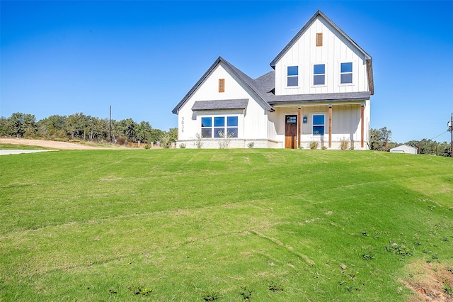 view of front of property with a front lawn and a porch