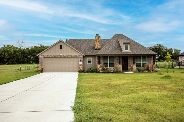 view of front facade featuring a garage, covered porch, and a front lawn