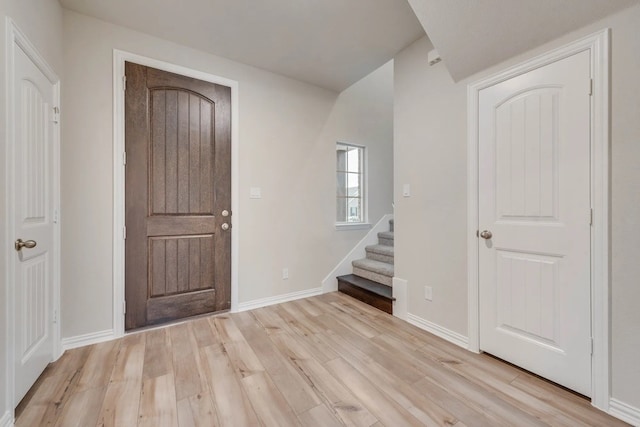 foyer entrance with light hardwood / wood-style flooring