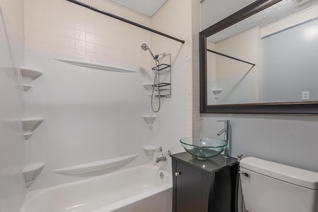 full bathroom with vanity, tub / shower combination, and toilet