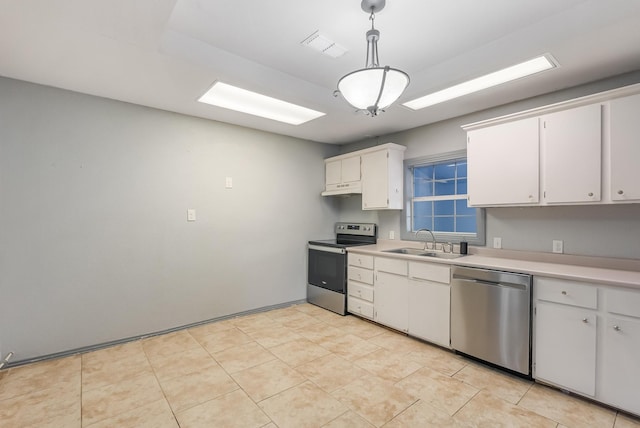 kitchen with white cabinetry, appliances with stainless steel finishes, decorative light fixtures, and sink