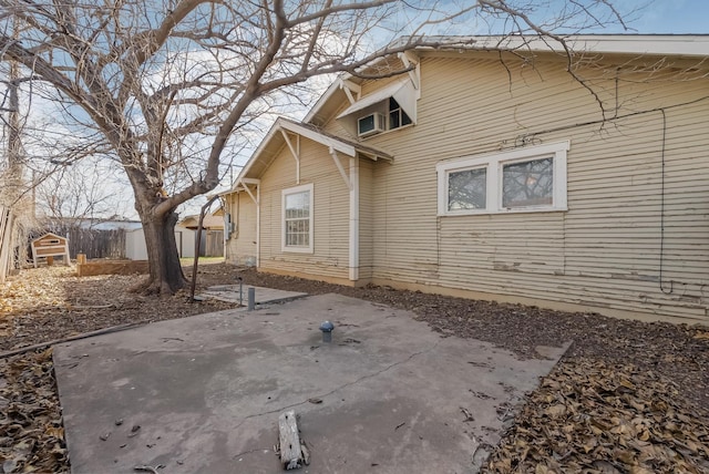 view of side of property featuring a patio