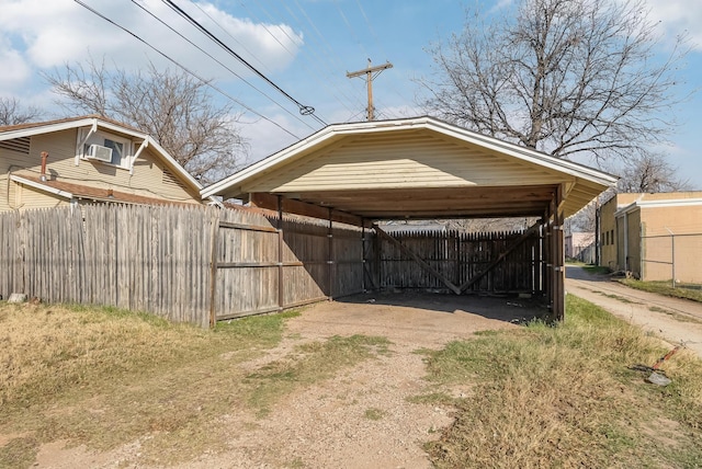 view of vehicle parking featuring a carport