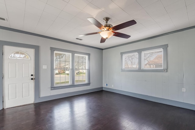 entryway with crown molding, ceiling fan, and dark hardwood / wood-style flooring