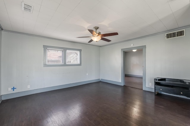 empty room featuring ceiling fan and dark hardwood / wood-style flooring