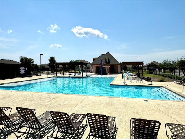 view of swimming pool featuring a patio area