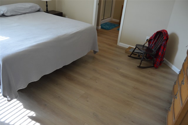 bedroom with light wood-type flooring