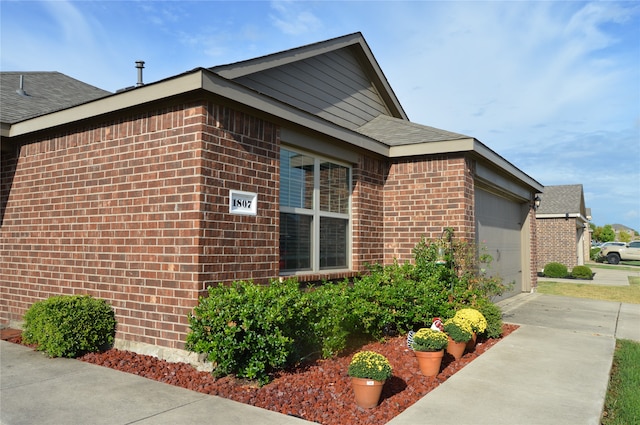 view of property exterior featuring a garage