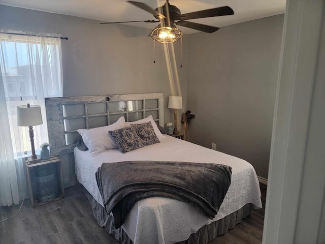 bedroom featuring dark wood-type flooring and ceiling fan