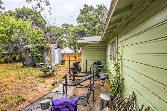 view of patio with a storage unit