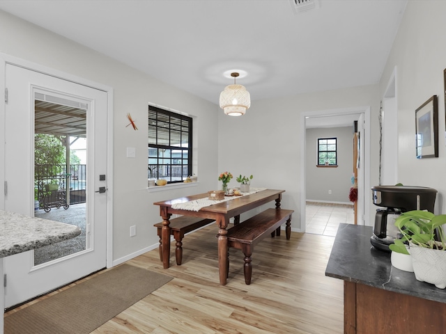 dining area with light wood-type flooring