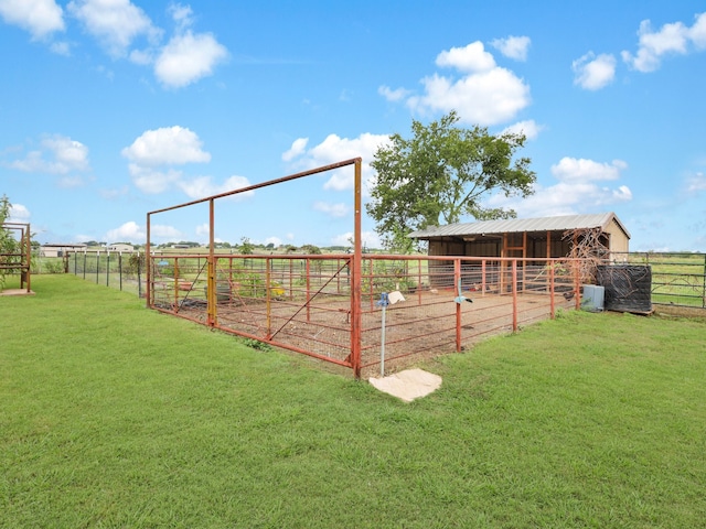 view of horse barn with a rural view