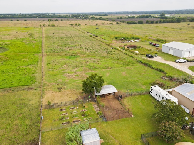 birds eye view of property with a rural view